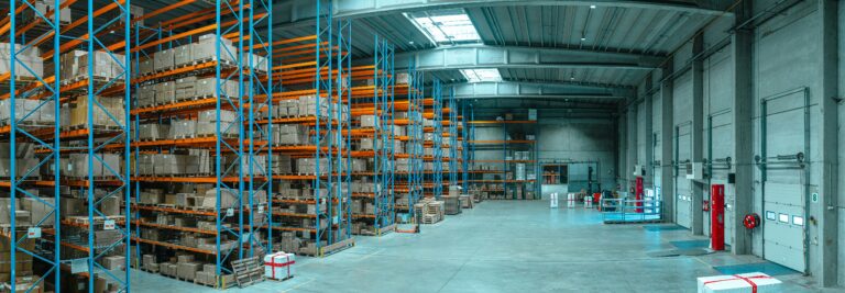 Tall warehouse shelving filled with cardboard boxes
